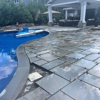 Luxury outdoor living space design and construction by Constructive Greens