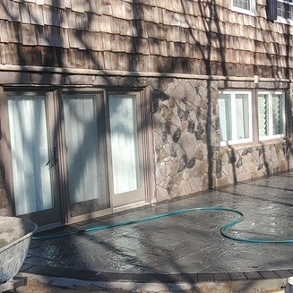 Modern paver patio installation by Constructive Greens
